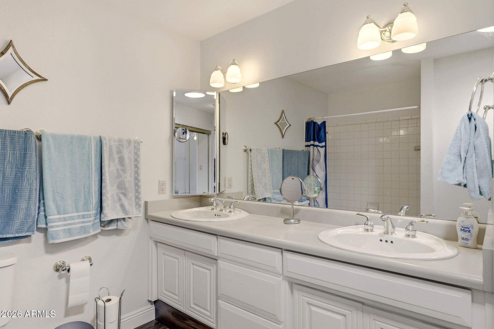 2746 Pineview Court Overgaard, AZ 85933 - Photo 18 of 30 a bathroom with a double vanity sink and a mirror