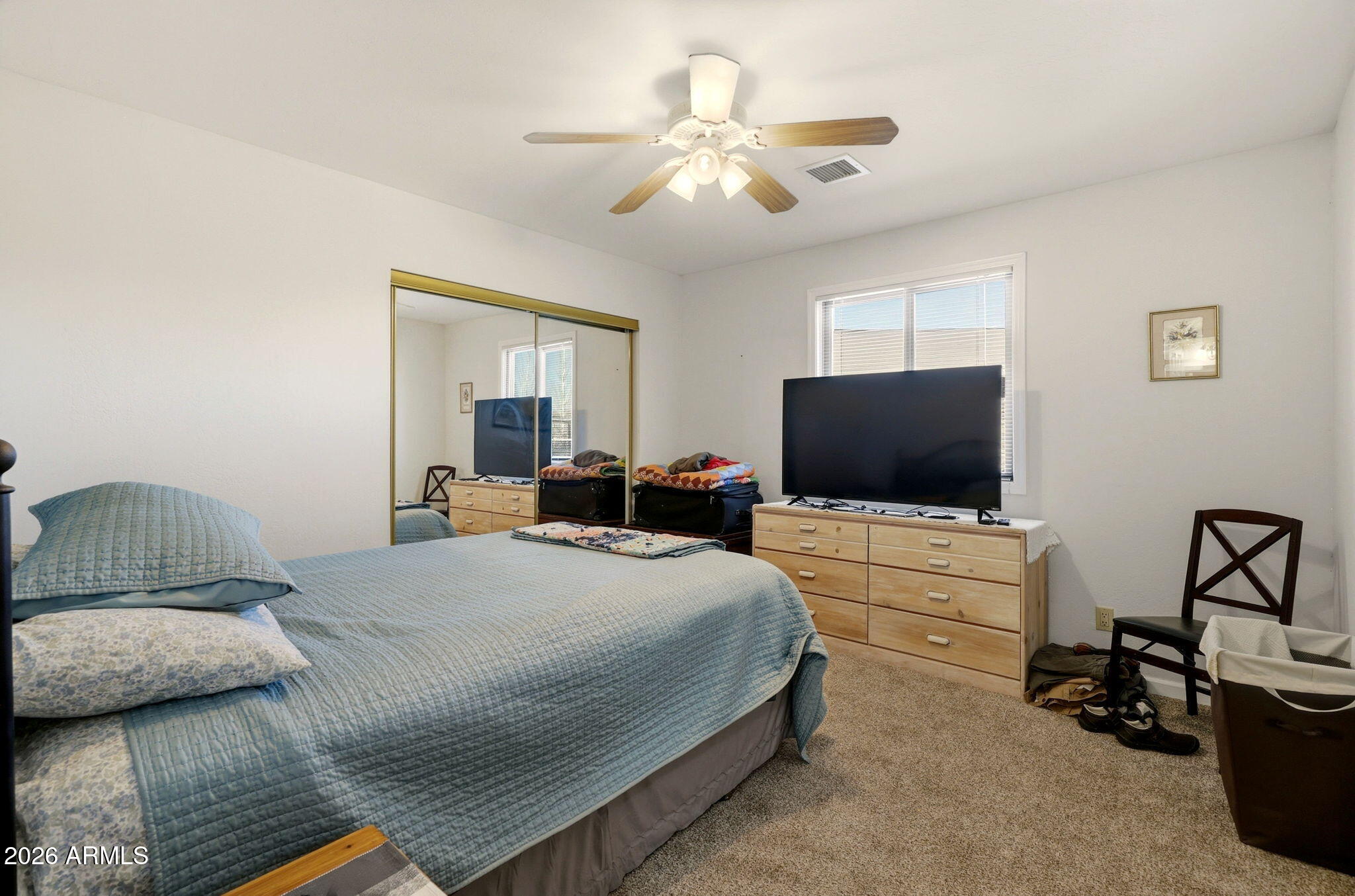 2746 Pineview Court Overgaard, AZ 85933 - Photo 21 of 30 a bedroom with a bed and a flat screen tv