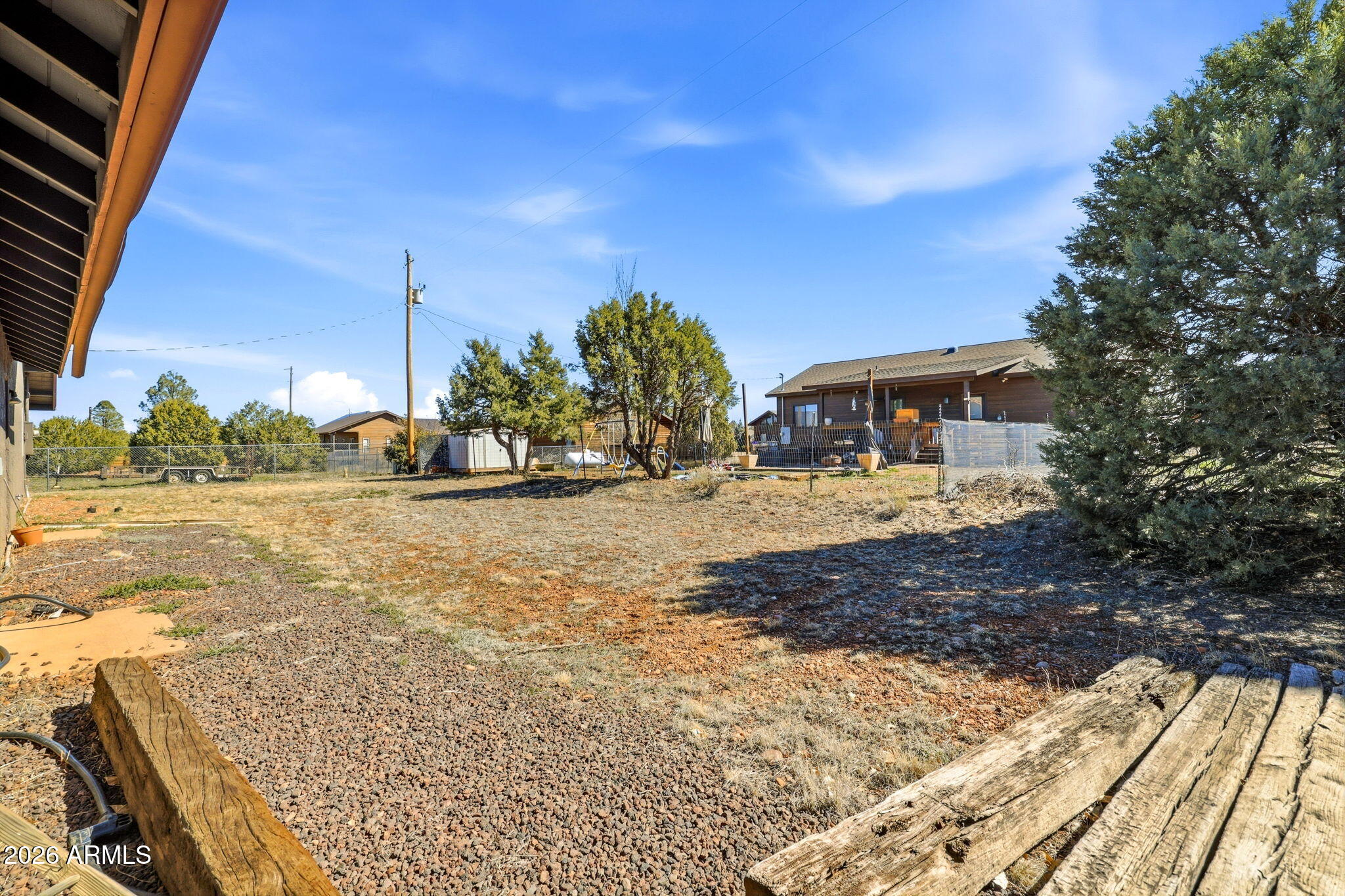 2746 Pineview Court Overgaard, AZ 85933 - Photo 30 of 30 a view of a street with view of a big yard