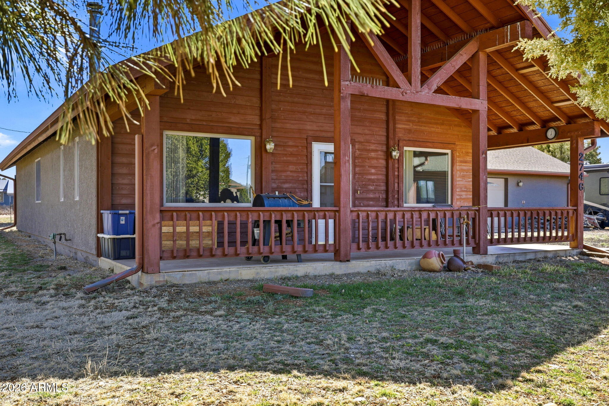 2746 Pineview Court Overgaard, AZ 85933 - Photo 3 of 30 front view of a house with a yard
