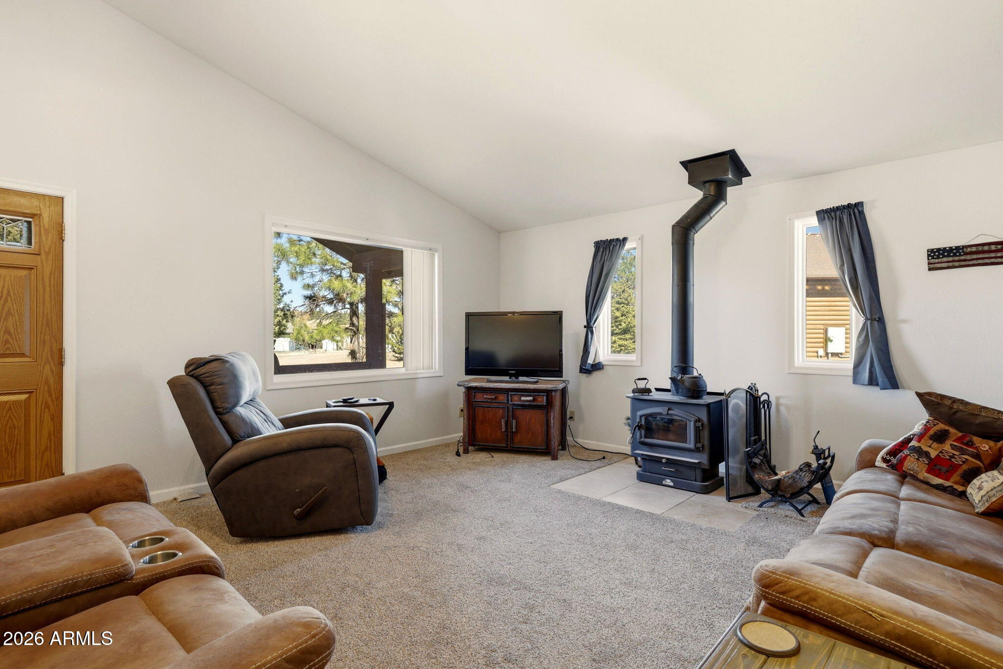 2746 Pineview Court Overgaard, AZ 85933 - Photo 9 of 30 a living room with furniture and a flat screen tv