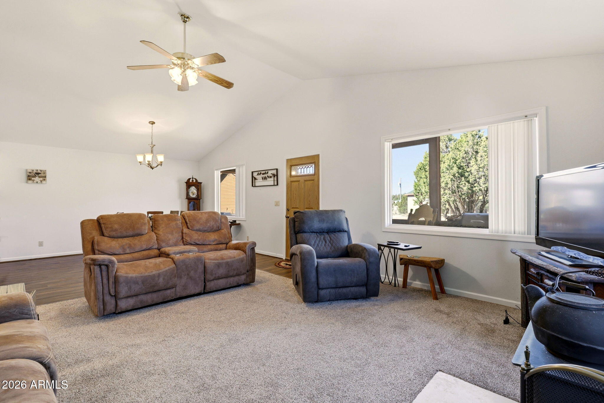 2746 Pineview Court Overgaard, AZ 85933 - Photo 10 of 30 a living room with furniture and a flat screen tv