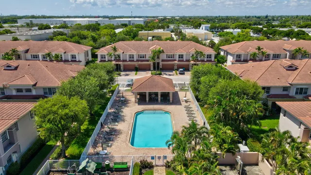 an aerial view of a houses with a city street