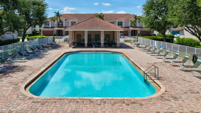 a view of a swimming pool with a patio