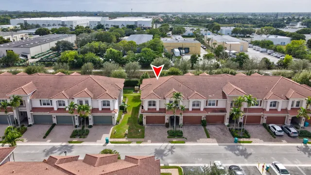 an aerial view of houses with yard