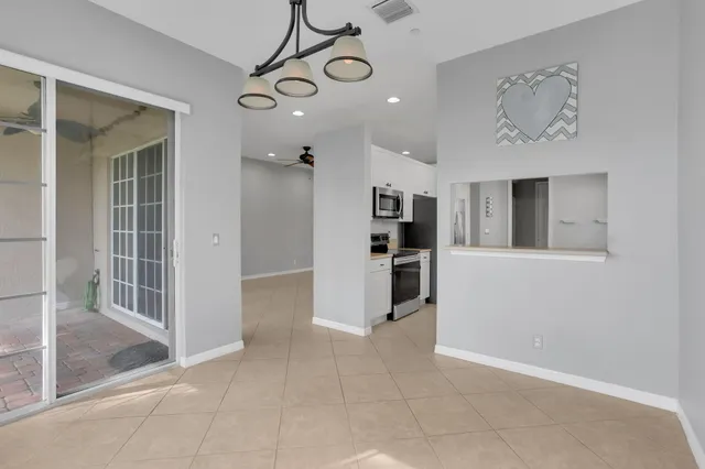 a view of a kitchen with furniture and a window
