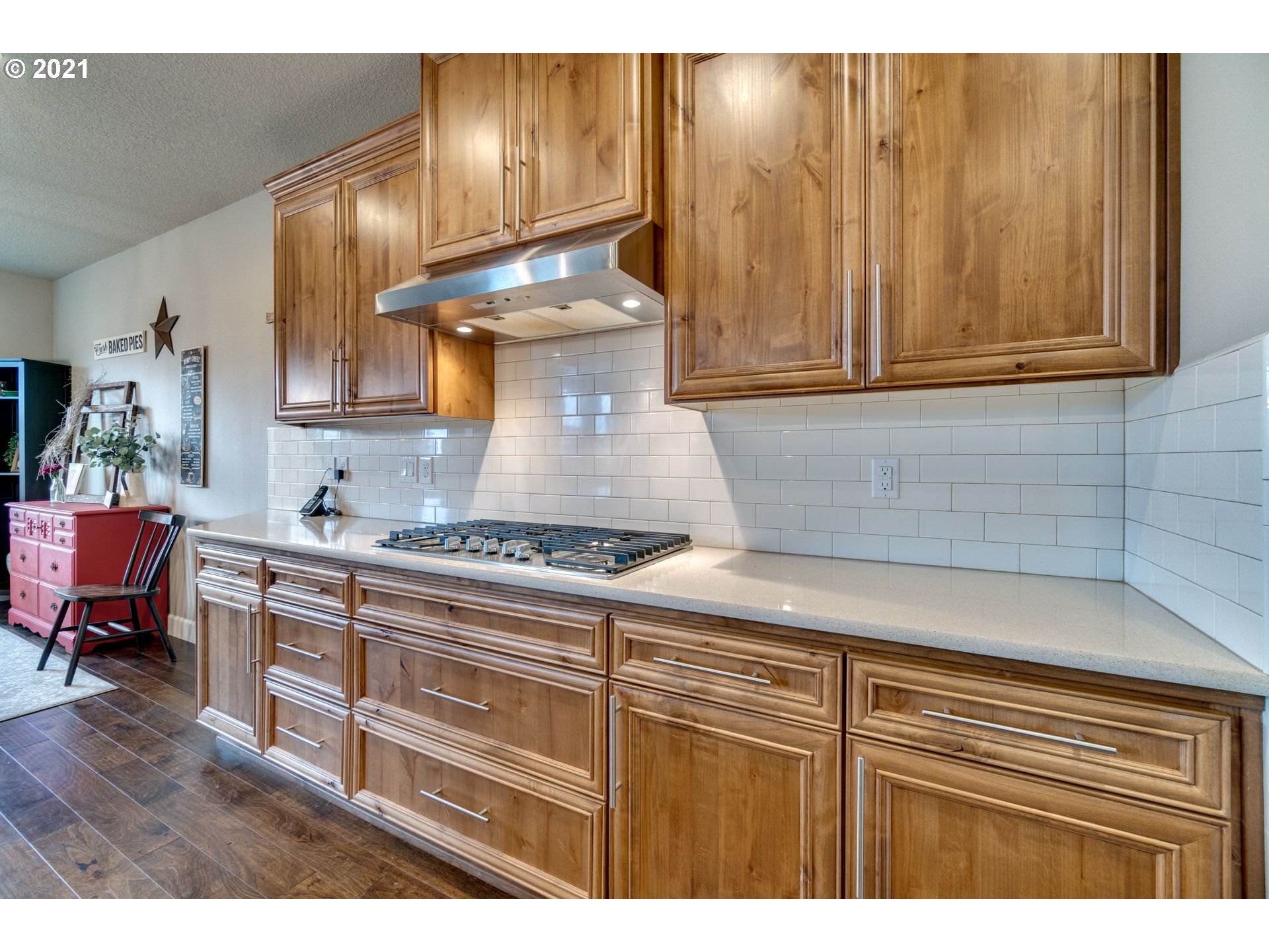 1695 South Nighthawk Road Ridgefield, WA 98642 - Photo 8 of 27 a kitchen with stainless steel appliances granite countertop a sink stove and cabinets