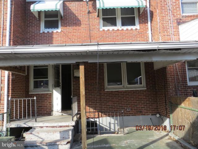 8149 Del Haven Road Baltimore, MD 21222 - Photo 14 of 18 a front view of a house with a yard