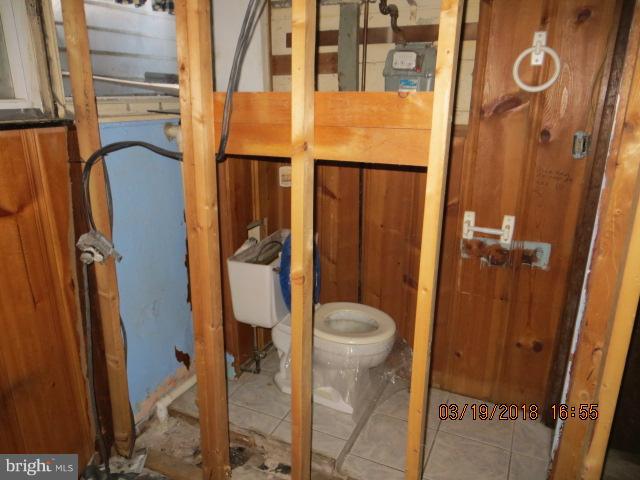 8149 Del Haven Road Baltimore, MD 21222 - Photo 4 of 18 a bathroom with a toilet and a shower