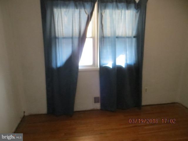 8149 Del Haven Road Baltimore, MD 21222 - Photo 10 of 18 an entryway door with wooden floor