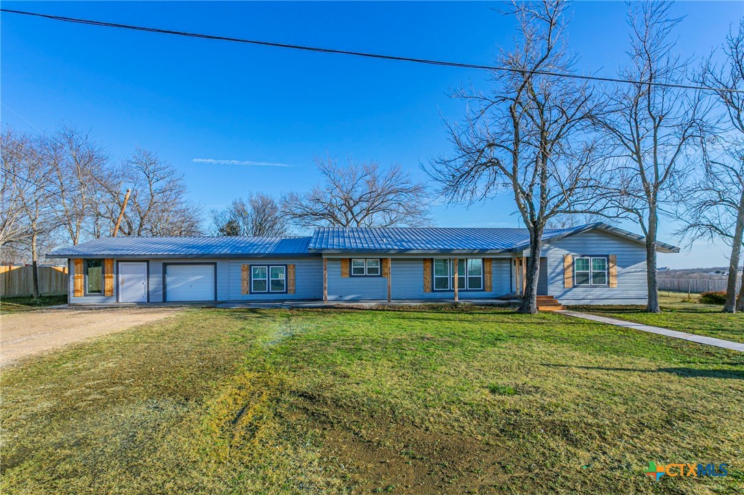 301 Thomas Street Rogers, TX 76569 - Photo 1 of 29 front view of a house with a yard
