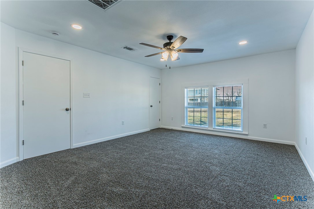 301 Thomas Street Rogers, TX 76569 - Photo 17 of 29 a view of an empty room with a window