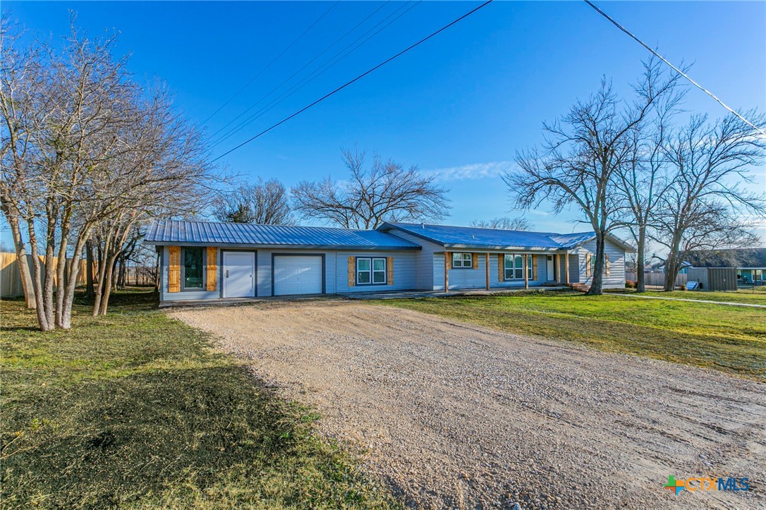 301 Thomas Street Rogers, TX 76569 - Photo 22 of 29 a front view of a house with a yard