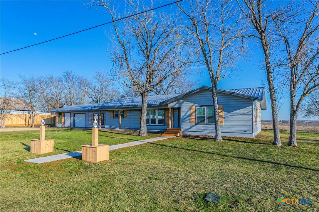 301 Thomas Street Rogers, TX 76569 - Photo 23 of 29 front view of a house with a yard