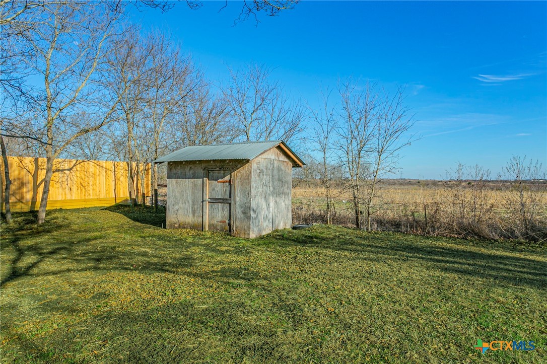 301 Thomas Street Rogers, TX 76569 - Photo 25 of 29 a view of a house with backyard and trees