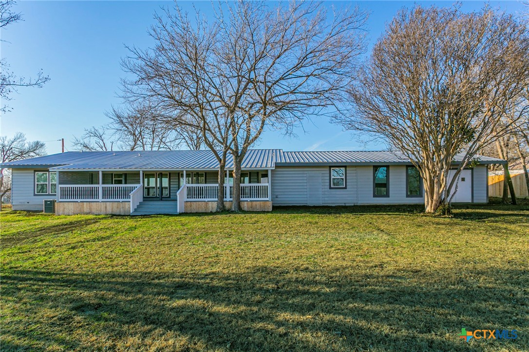 301 Thomas Street Rogers, TX 76569 - Photo 26 of 29 a front view of a house with a garden
