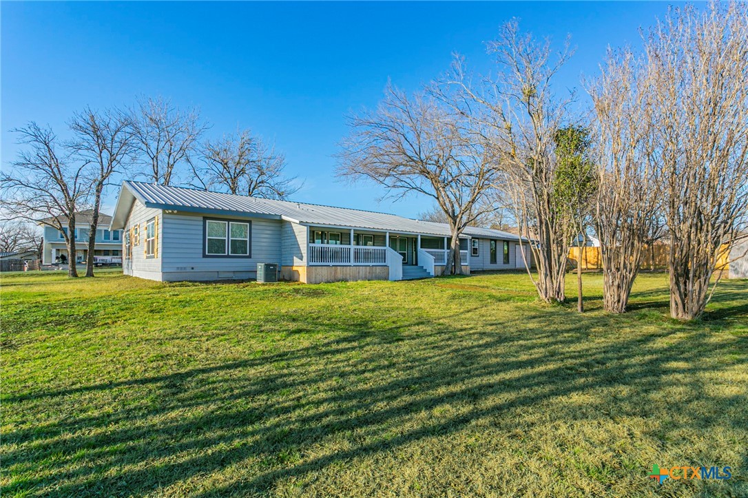 301 Thomas Street Rogers, TX 76569 - Photo 27 of 29 a front view of a house with a yard