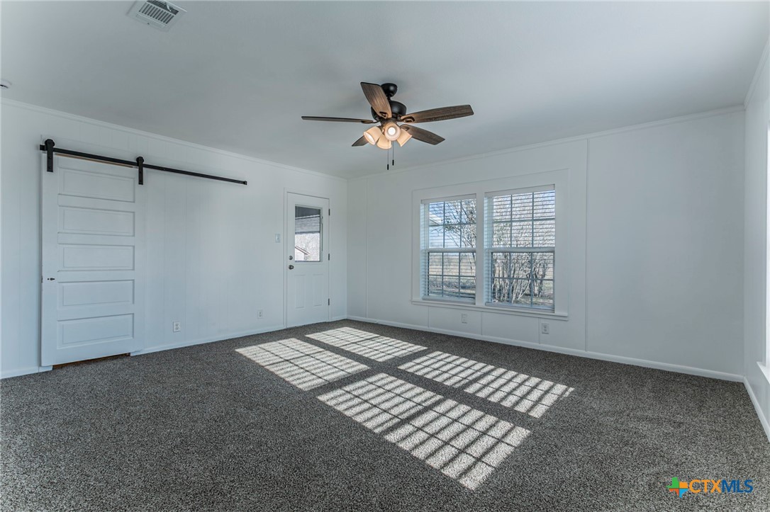 301 Thomas Street Rogers, TX 76569 - Photo 10 of 29 a view of an empty room with a window