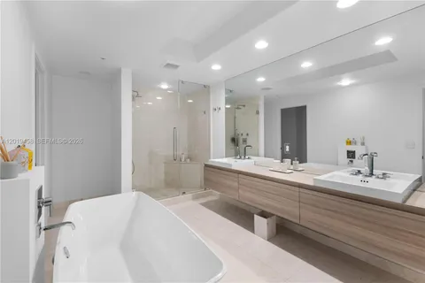 a bathroom with a toilet a sink and a mirror
