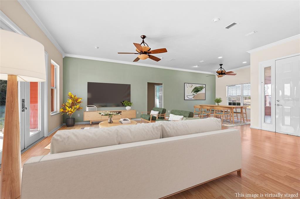 10215 Southwest 98th Avenue Gainesville, FL 32608 - Photo 12 of 43 a living room with furniture and a flat screen tv