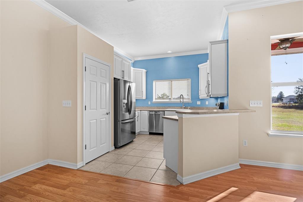 10215 Southwest 98th Avenue Gainesville, FL 32608 - Photo 15 of 43 a kitchen with stainless steel appliances a refrigerator sink and cabinets