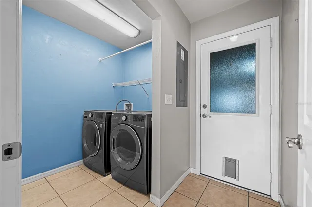 a view of a hallway with washer and dryer