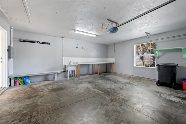 a view of empty room with a fireplace and window