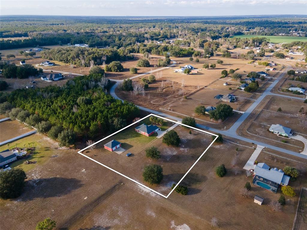 10215 Southwest 98th Avenue Gainesville, FL 32608 - Photo 3 of 39 an aerial view of residential houses with outdoor space