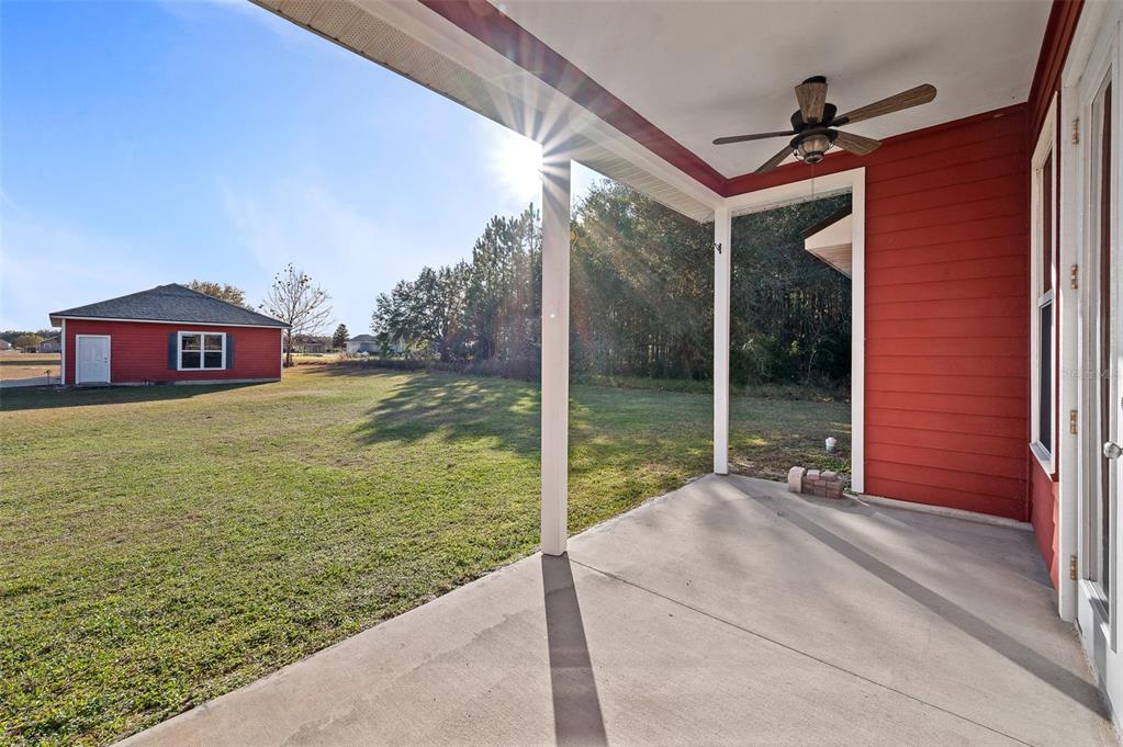 10215 Southwest 98th Avenue Gainesville, FL 32608 - Photo 34 of 43 a view of a house with a yard