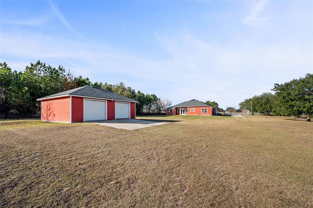 10215 Southwest 98th Avenue Gainesville, FL 32608 - Photo 35 of 43 a big house with a big yard and large trees