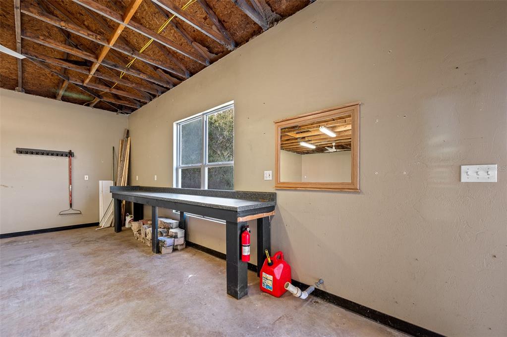 10215 Southwest 98th Avenue Gainesville, FL 32608 - Photo 36 of 39 a view of a room with workspace and windows