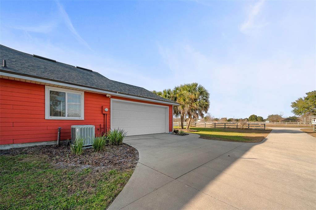 10215 Southwest 98th Avenue Gainesville, FL 32608 - Photo 37 of 39 a front view of house with yard and outdoor seating