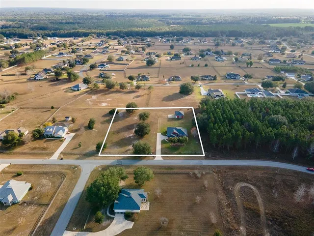 an aerial view of a house with a garden