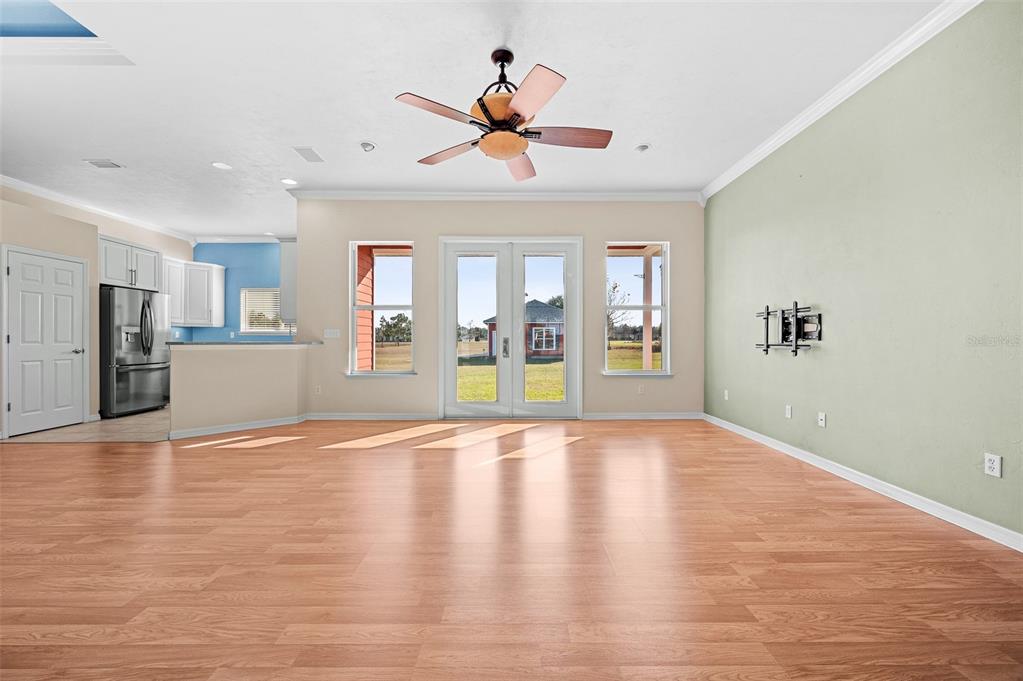 10215 Southwest 98th Avenue Gainesville, FL 32608 - Photo 8 of 39 a view of an empty room with a window and wooden floor