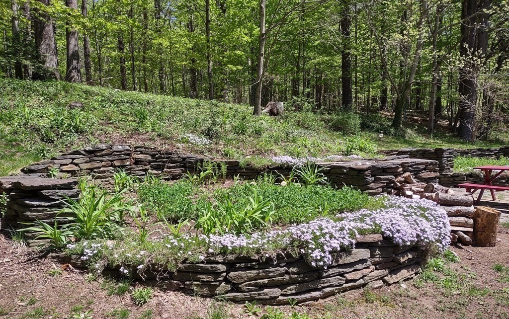 456 Zoar Road Charlemont, MA 01339 - Photo 35 of 40 a view of a garden with a fountain