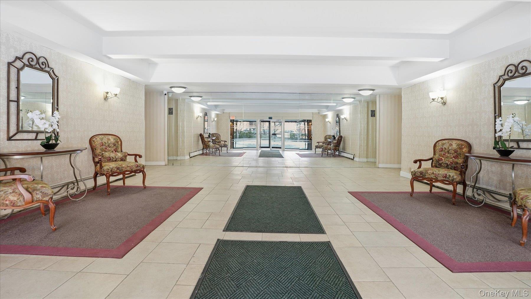 46 Grace Avenue, Unit 1L Great Neck, NY 11021 - Photo 13 of 16 a lobby with furniture