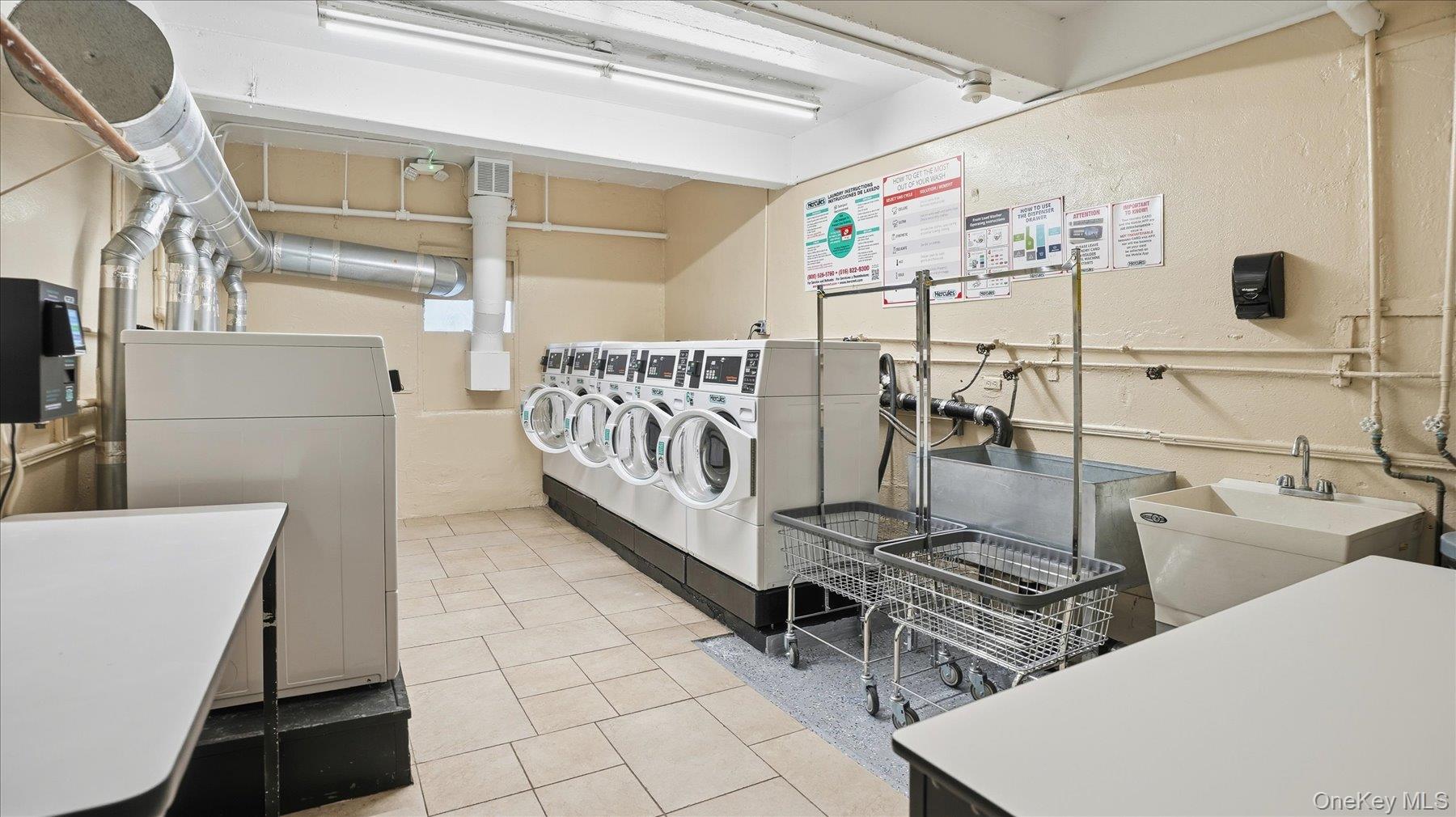 46 Grace Avenue, Unit 1L Great Neck, NY 11021 - Photo 14 of 16 a view of a room with racks on the wall