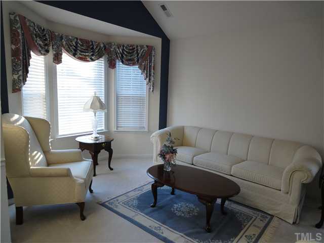 4621 Drewbridge Way Raleigh, NC 27604 - Photo 3 of 25 The big bay window in the vaulted living room really expands your room.