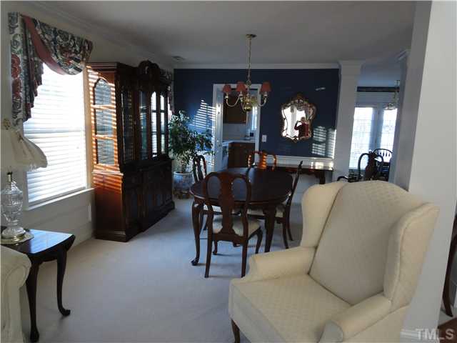 4621 Drewbridge Way Raleigh, NC 27604 - Photo 4 of 25 Dining room adjoins living room & features decorative columns.