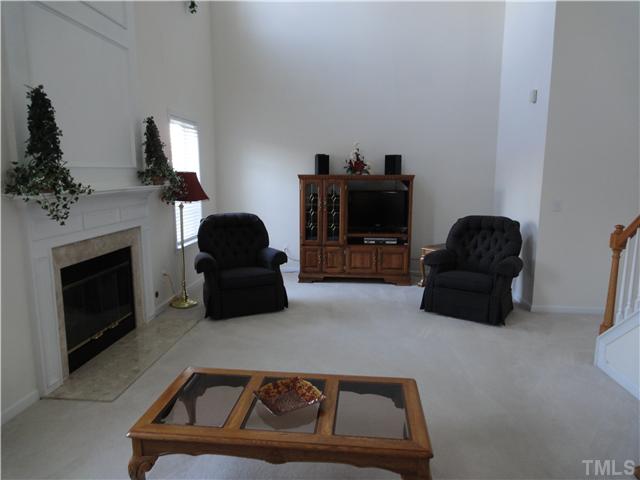 4621 Drewbridge Way Raleigh, NC 27604 - Photo 8 of 25 Enjoy the beautiful marble surround fireplace in your two story family room.