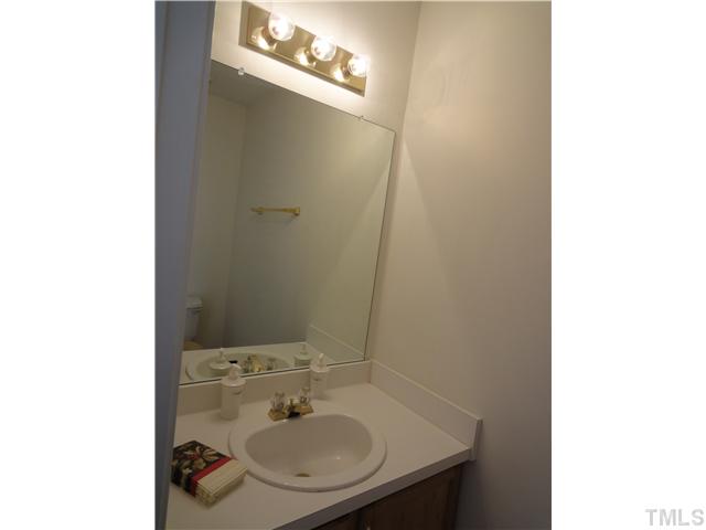 4621 Drewbridge Way Raleigh, NC 27604 - Photo 10 of 25 Half bath features a cultured marble counter.