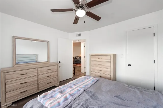 a bedroom with a bed and a dresser
