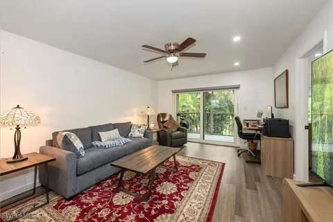 a living room with furniture and a rug