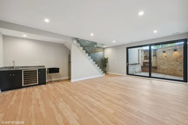 a view of a hall with wooden floor