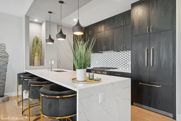 a kitchen with a sink and a refrigerator