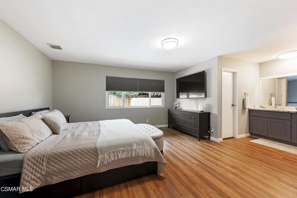 2125 Yosemite Avenue Simi Valley, CA 93063 - Photo 11 of 31 a bedroom with a bed and a flat screen tv