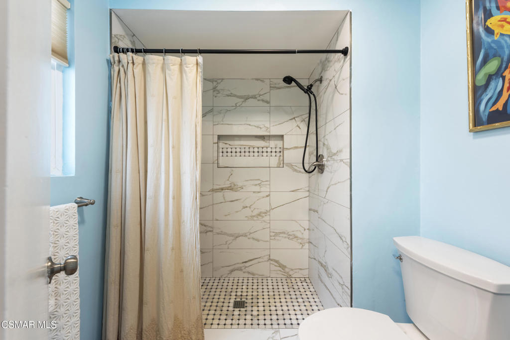 2125 Yosemite Avenue Simi Valley, CA 93063 - Photo 13 of 31 a bathroom with a toilet and a shower