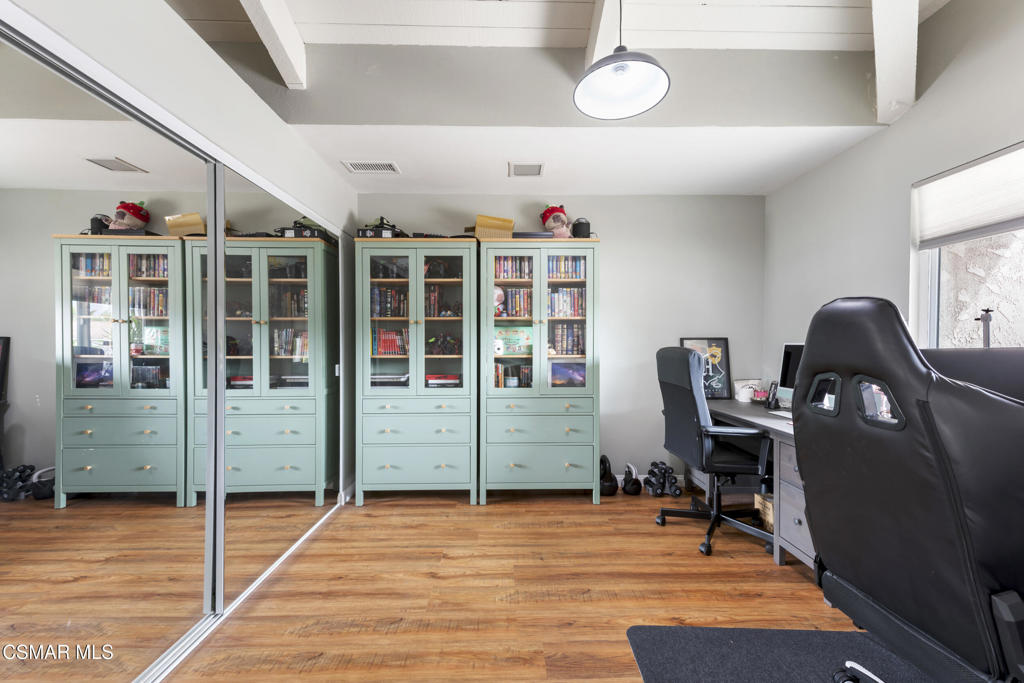 2125 Yosemite Avenue Simi Valley, CA 93063 - Photo 19 of 31 a view of a workspace with furniture and a window