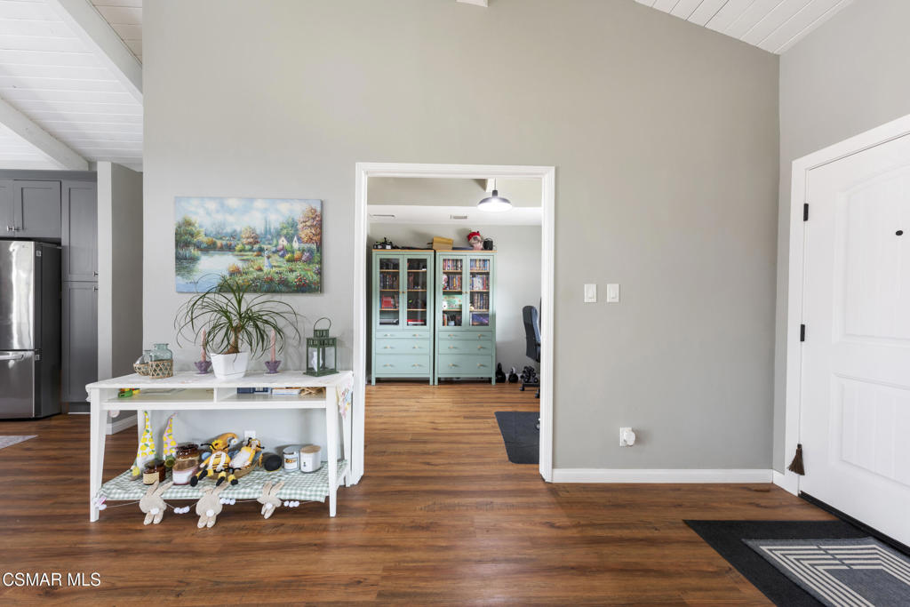 2125 Yosemite Avenue Simi Valley, CA 93063 - Photo 21 of 31 a view of a living room and kitchen with furniture and wooden floor