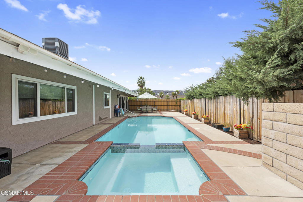 2125 Yosemite Avenue Simi Valley, CA 93063 - Photo 26 of 31 a swimming pool with yard in front of it